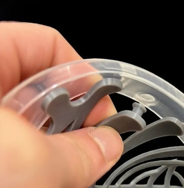 Hand installing a snap for lacrosse mesh in a clear head