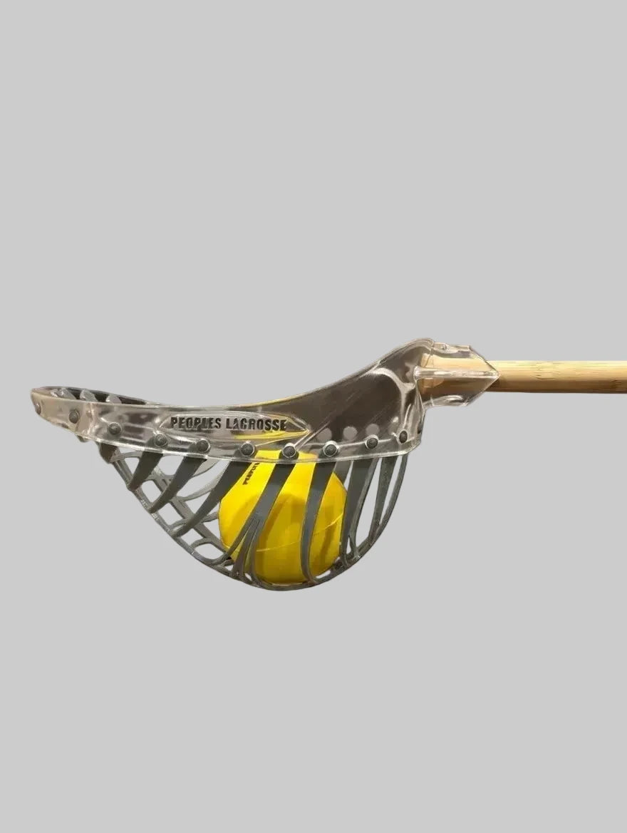 Clear lacrosse head with grey mesh and yellow foam ball
