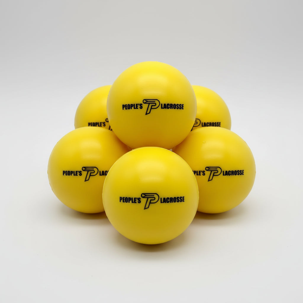 Yellow foam balls for indoor lacrosse training with a brand logo on a white background