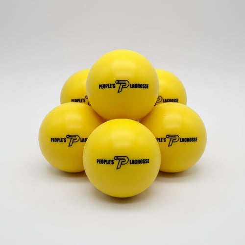 Yellow foam balls for indoor lacrosse training with a brand logo on a white background