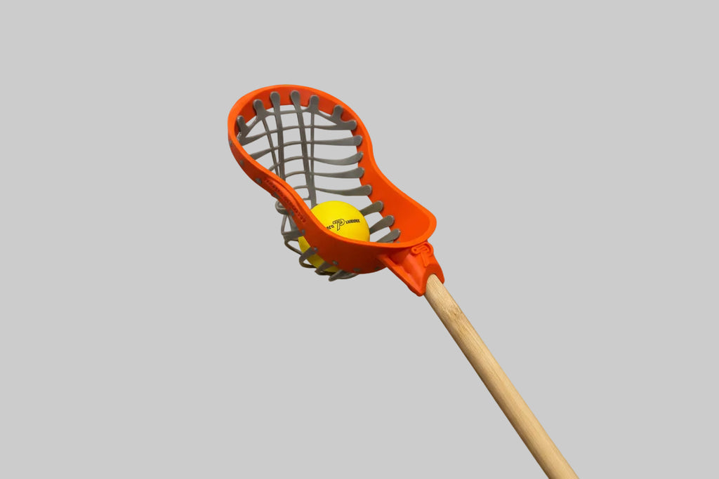 Orange lacrosse head with a yellow ball 
