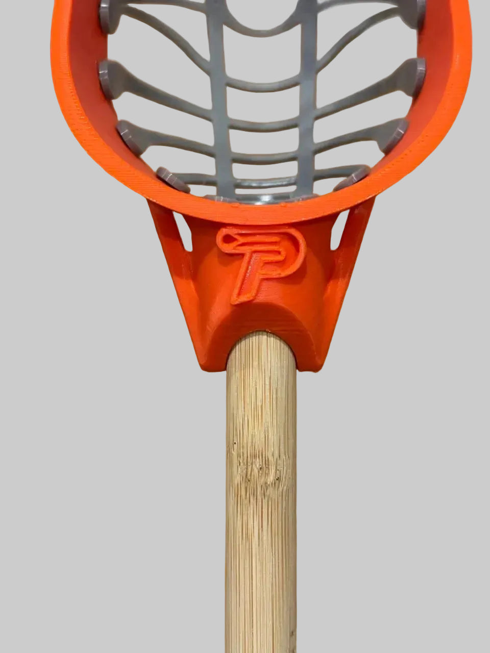 Orange and grey lacrosse stick