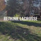 handsome man shoots wiffle balls with the people's lacrosse skill stick into a net in his backyard